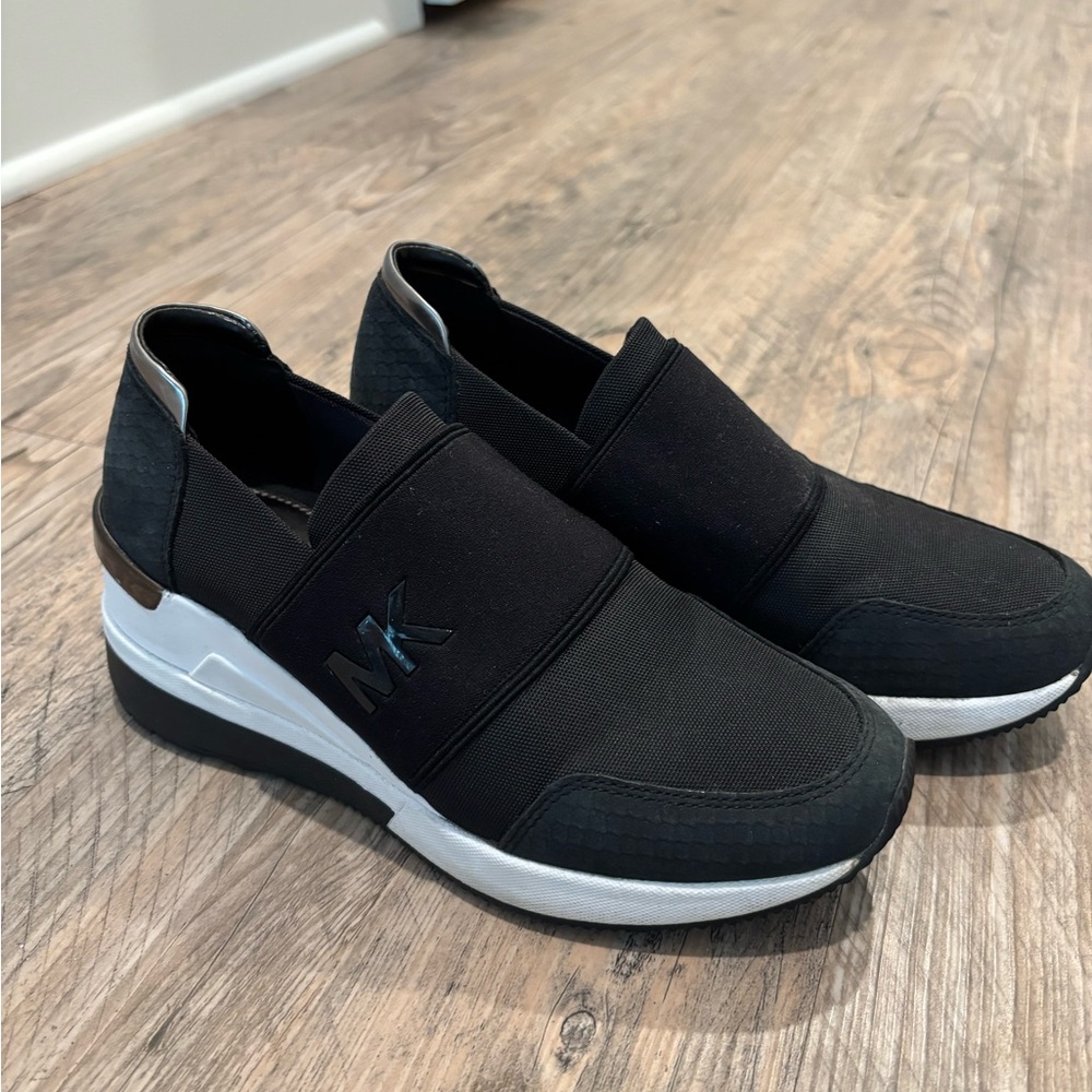 Michael Kors Women’s black  and White Slip-On Sneakers
